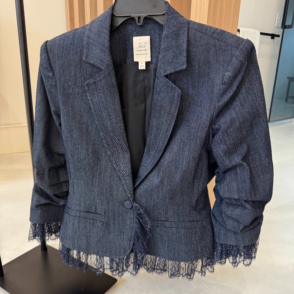 Light navy blue, cropped blazer with lace trim.